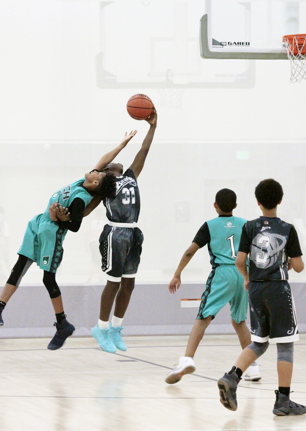 boys playing basketball