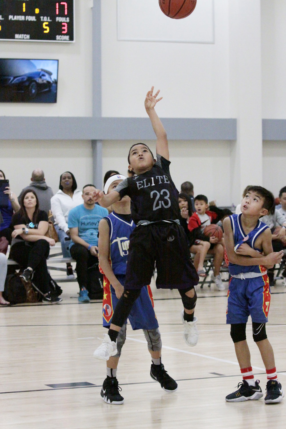 kid shooting a basket