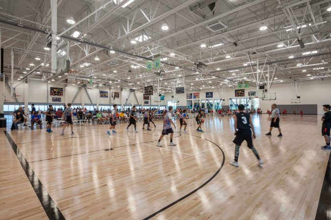 Eight basketball and volleyball courts with premium wood flooring.