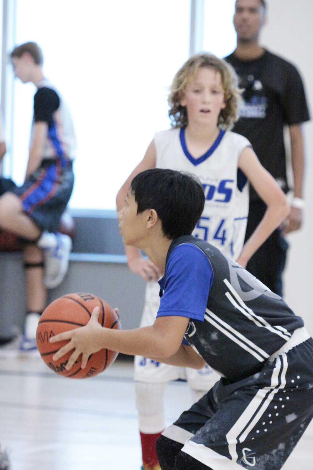 kid playing basketball